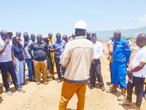 Didas Muhumuza of Petroleum Authority of Uganda (PAU) briefing members of Civil Society on Oil and Gas(CSCO) about the facilities being constructed at Kingfisher oil field